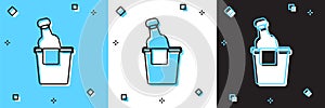 Set Bottle of champagne in an ice bucket icon isolated on blue and white, black background. Vector