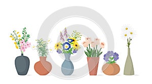 A set of bouquets of spring flowers in clay vases.Vector illustration