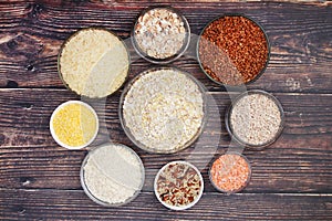 A set of bowls filled with different seeds: buckwheat, rise, corn and oatmeal