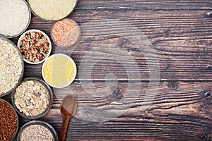 A set of bowls filled with different seeds: buckwheat, rise, corn and oatmeal