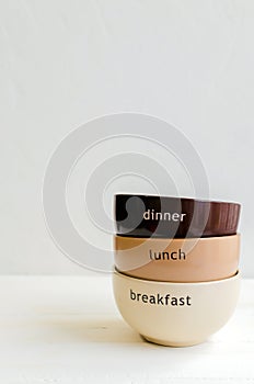 Set of bowls. Written breakfas, lunch, dinner
