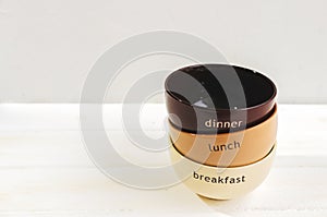 Set of bowls. Written breakfas, lunch, dinner