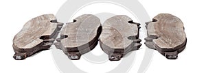 A set of brake pads on a white isolated background in a photo studio of auto parts for replacement during the repair of the