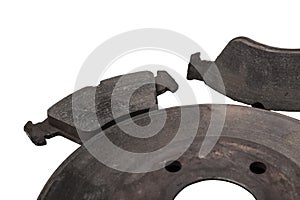 A set of brake pads on a white isolated background in a photo studio of auto parts for replacement during the repair of the
