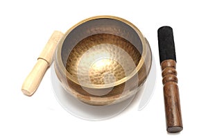 A set of brass handmade Tibetan singing bowl with wooden strikers photo