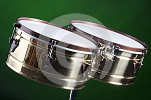 Set of Brass Timbales Isolated on Green