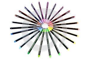 A set of bright multi-colored felt-tip markers lie