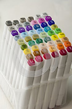 Set of bright multi-colored felt-tip pens or markers with designation of numbers and the name of color. Photo for creativity,