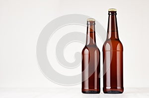 Set of brown longneck beer bottles 500ml and 330ml mock up.