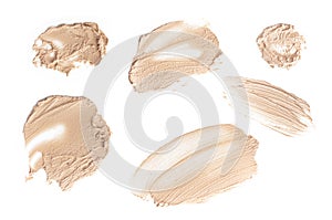 Set of brush strokes for makeup in different colour isolated on white background. Foundation face make-up samples, texture of face