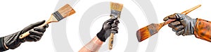 Set of brushes in a gloved hand isolated on a white or transparent background. Close-up of a brushes in hand, front view