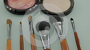 Set of brushes for make-up on table in dressing room. Fashion industry. Fashion show backstage