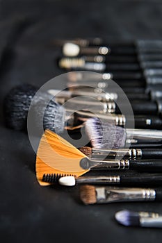 A set of brushes for makeup. Professional makeup brushes set close-up, away kick