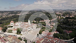 Set of buildings of Sintra National Palace with two conical chimneys standing out. Aerial view