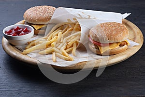 Set of burgers on a wooden board. cheeseburger with beef, cheese and vegetables. burger with chicken nuggets