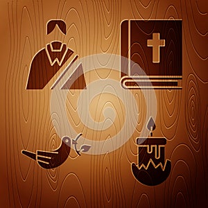 Set Burning candle, Jesus Christ, Peace dove with olive branch and Holy bible book on wooden background. Vector