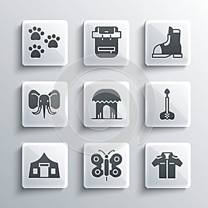 Set Butterfly, Shirt, Arrow, African hut, Tourist tent, Elephant, Paw print and Hunter boots icon. Vector