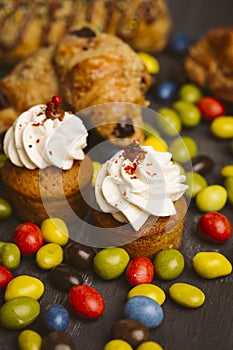 Set of cakes on a dark background.