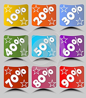 Set of cambered paper labels with percent in different colors with stars and shadow.