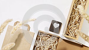 Set of cardboard boxes with shredded paper inside, paper bag