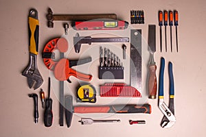 A set of carpentry and locksmith tools laid out on the table.