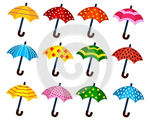 A set of cartoon umbrellas with different patterns. Vector isolated on a white background