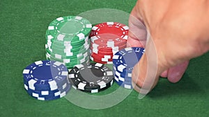 Set of casino chips on green table