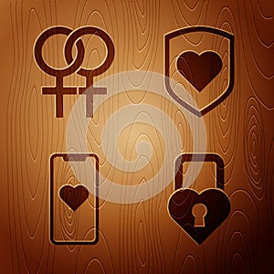 Set Castle in the shape of a heart, Female gender symbol, Mobile phone with heart and Heart with shield on wooden