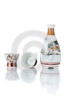 Set Ceramic bottles and cup Japanese style sake oriental drink, front view, and reflection isolated on a white background are