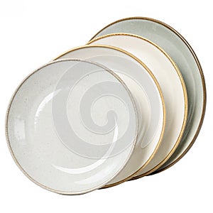 Set of ceramic round plates isolated on white background