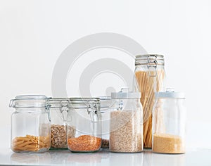 Set in cereals in the jar of glass on a white background, pasta