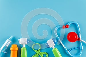 A set for children consisting of a stethoscope, a syringe, a hammer, forceps, scissors, tablets and eyepieces for playing doctor,