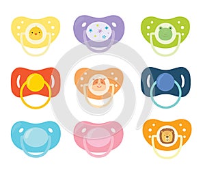 Set of children`s pacifiers. Baby care equipment. Vector illustration.