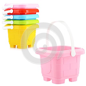 A set of children's plastic buckets isolated on a white background. Toys for playing in the sandbox or on the beach