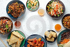 Set of Chinese dishes on white table copy space