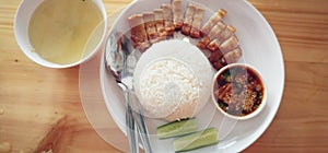 Set of chinese style crispy pork rice fat with rice serves with soup, side dish and dipping sauce