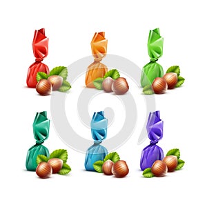 Set of Chocolate Candies with Hazelnuts in Colored Foil Wrapper Close up on White Background
