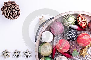 Set of Christmas decorations in wooden tray on white background. Holiday concept. Flat lay, top view