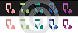 Set Christmas stocking icon isolated on black and white background. Merry Christmas and Happy New Year. Vector