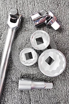 Set of chromeplated wrench dadoes set close up, on a wood background