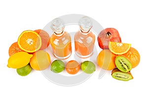 Set of citrus fruits and fruit juice bottles isolated on white