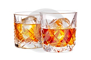 Set of classic Old Fashioned cocktails in a crystal-cut rocks glass isolated on white backdrop