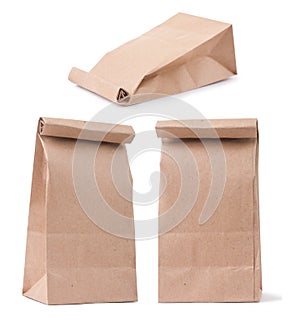 set of classical brown paper bag in three different foreshortenings isolated on white photo