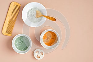 Set of clay masks in bowls for face and hair treatment. Flat lay, top view. SPA natural organic cosmetic products, skincare