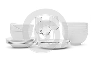 Set clean dishes glasses on white