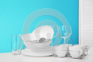 Set of clean dishware on table