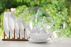 Set of clean dishware on table