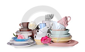 Set of clean tableware with flowers on white background