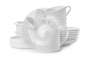 Set of clean tableware on white background.