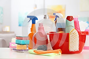 Set of cleaning supplies on table